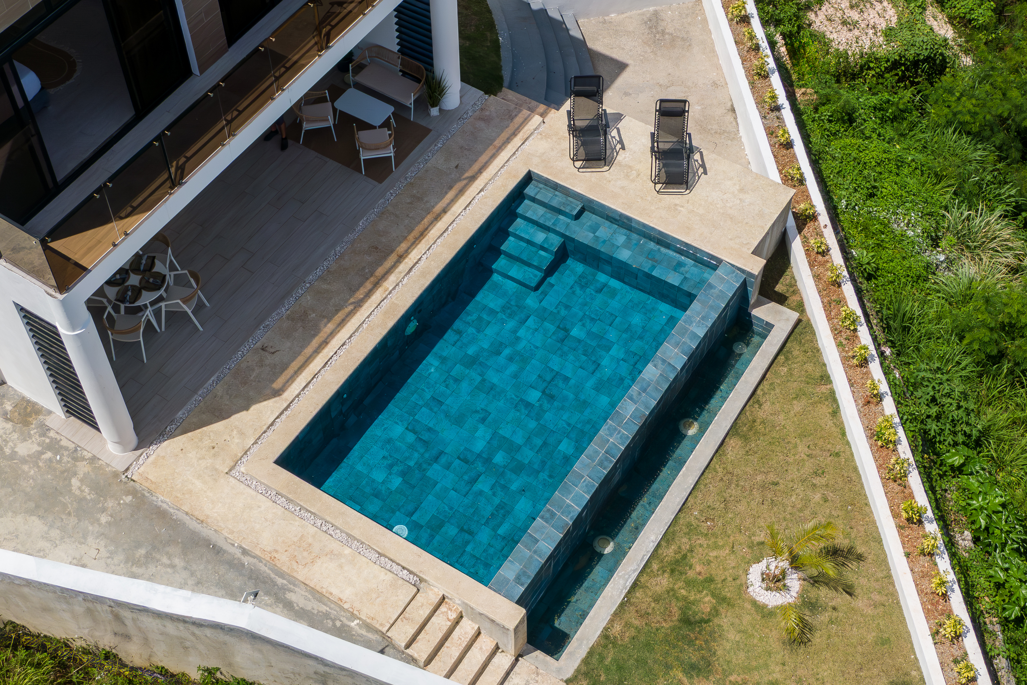 Aerial drone view of pool, terrace and garden