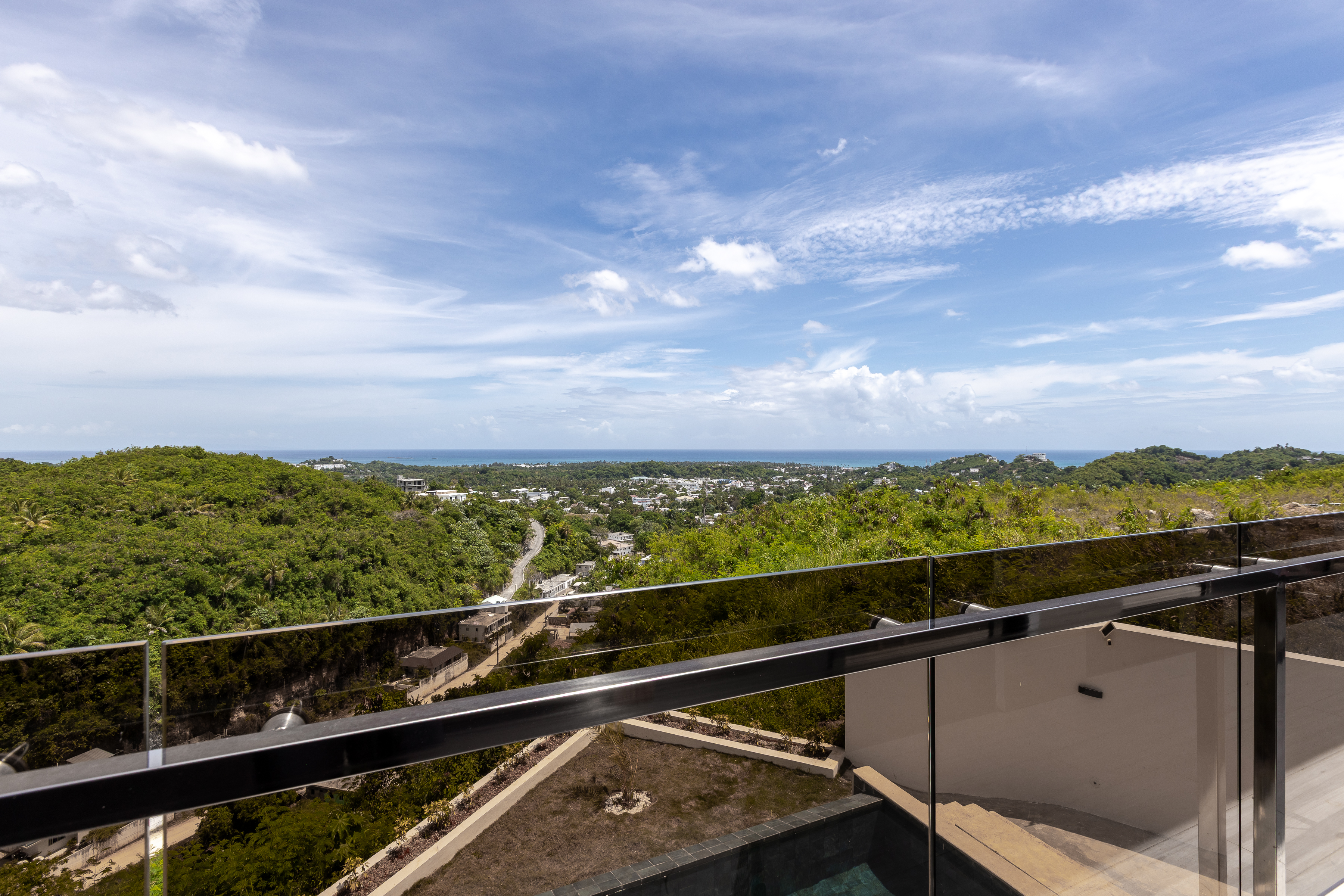 Panoramic balcony view — mountains, Las Terrenas and the Caribbean Sea
