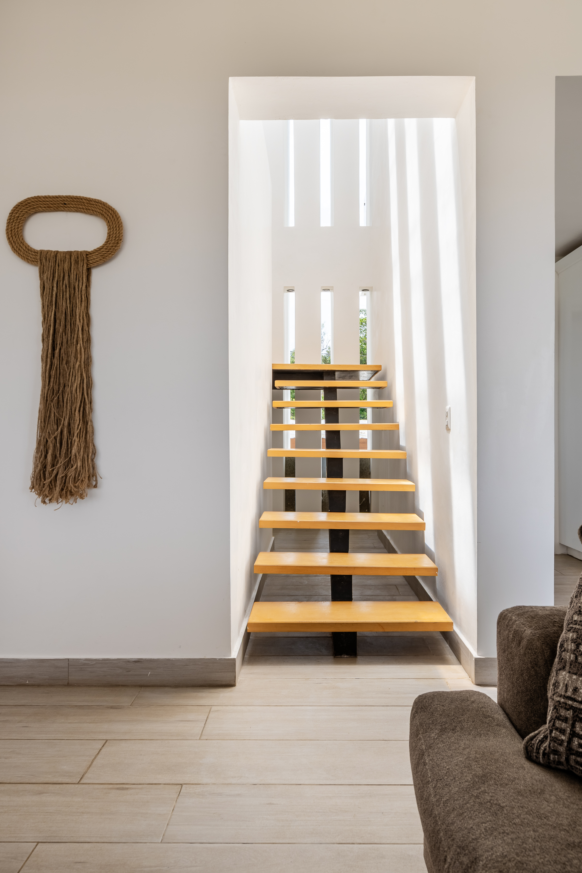 Floating wood staircase with architectural light slats